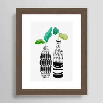 Modern tropical art with tribal vase design framed in rich walnut finish