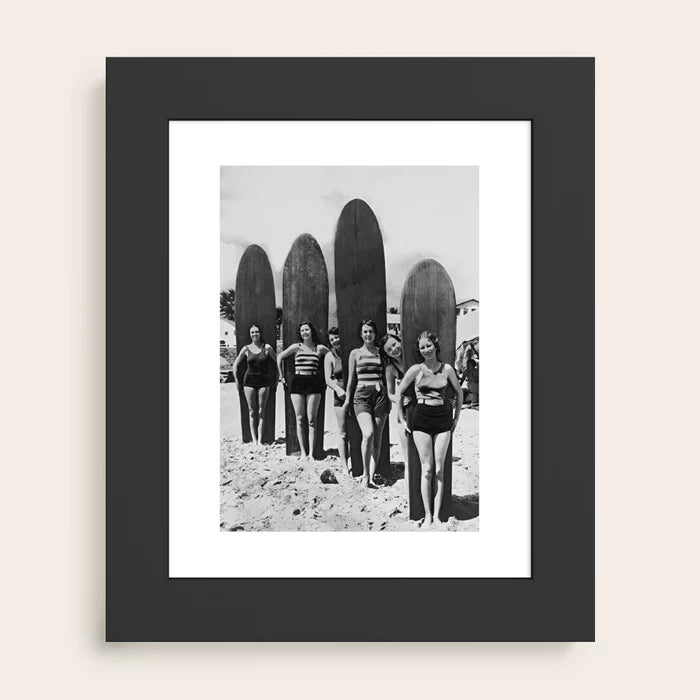 Woman Surfers black and white vintage beach art print by Vintage Vivian framed in sleek black wood for modern coastal interiors