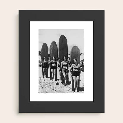 Woman Surfers black and white vintage beach art print by Vintage Vivian framed in sleek black wood for modern coastal interiors