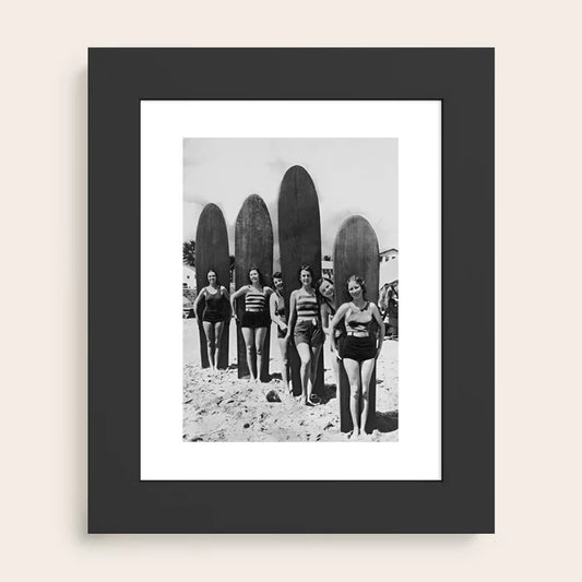 Woman Surfers black and white vintage beach art print by Vintage Vivian framed in sleek black wood for modern coastal interiors