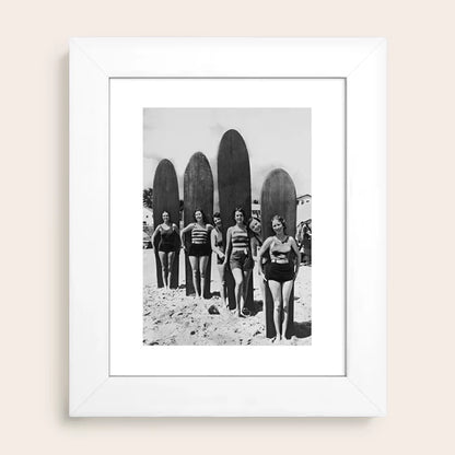 Woman Surfers black and white beach photography print by Vintage Vivian in white hardwood frame, ideal for minimal or coastal décor